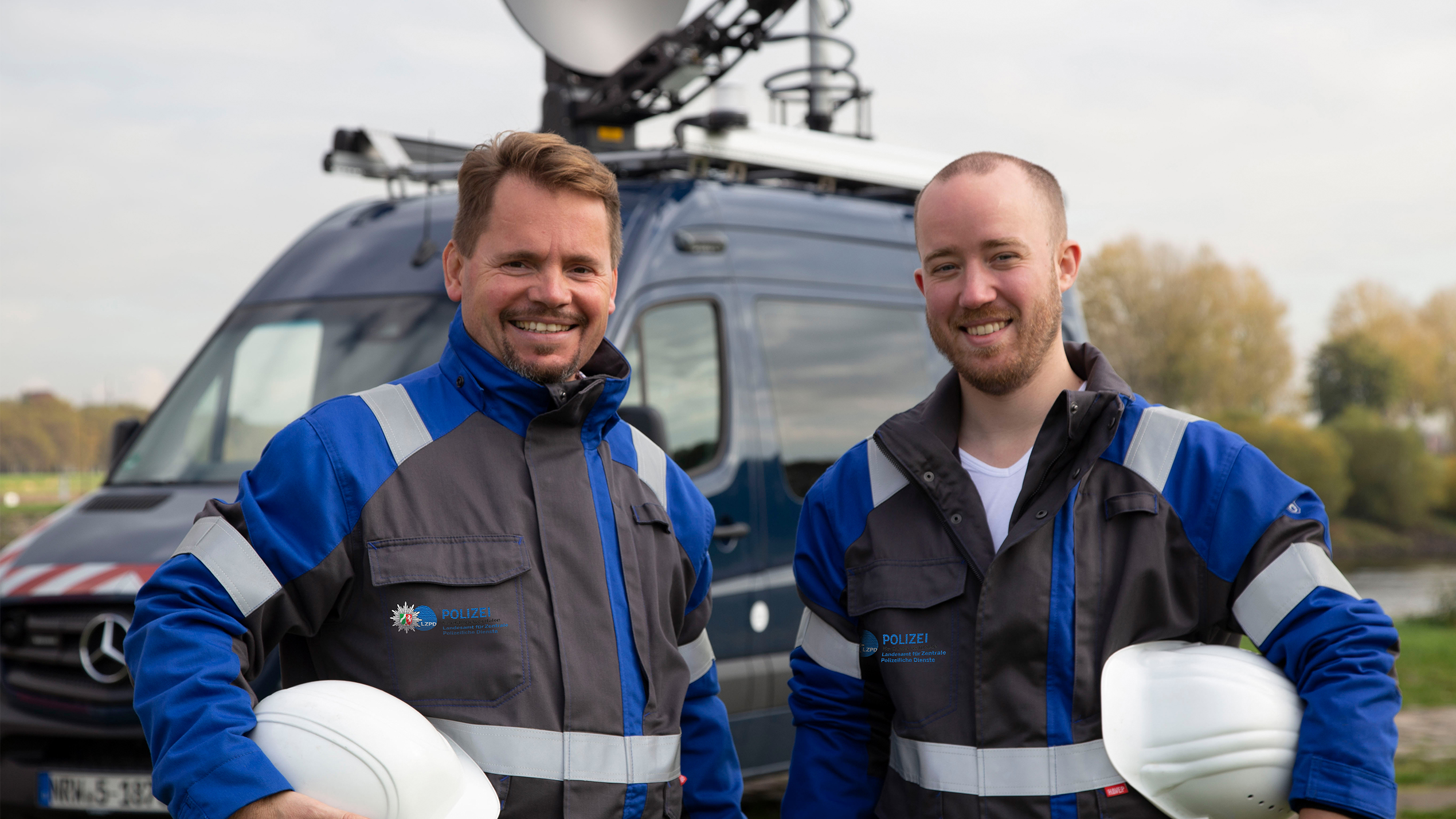 Technicians in front of a radio bus