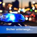 Polizeiautolicht vor beleuchteter Stadt